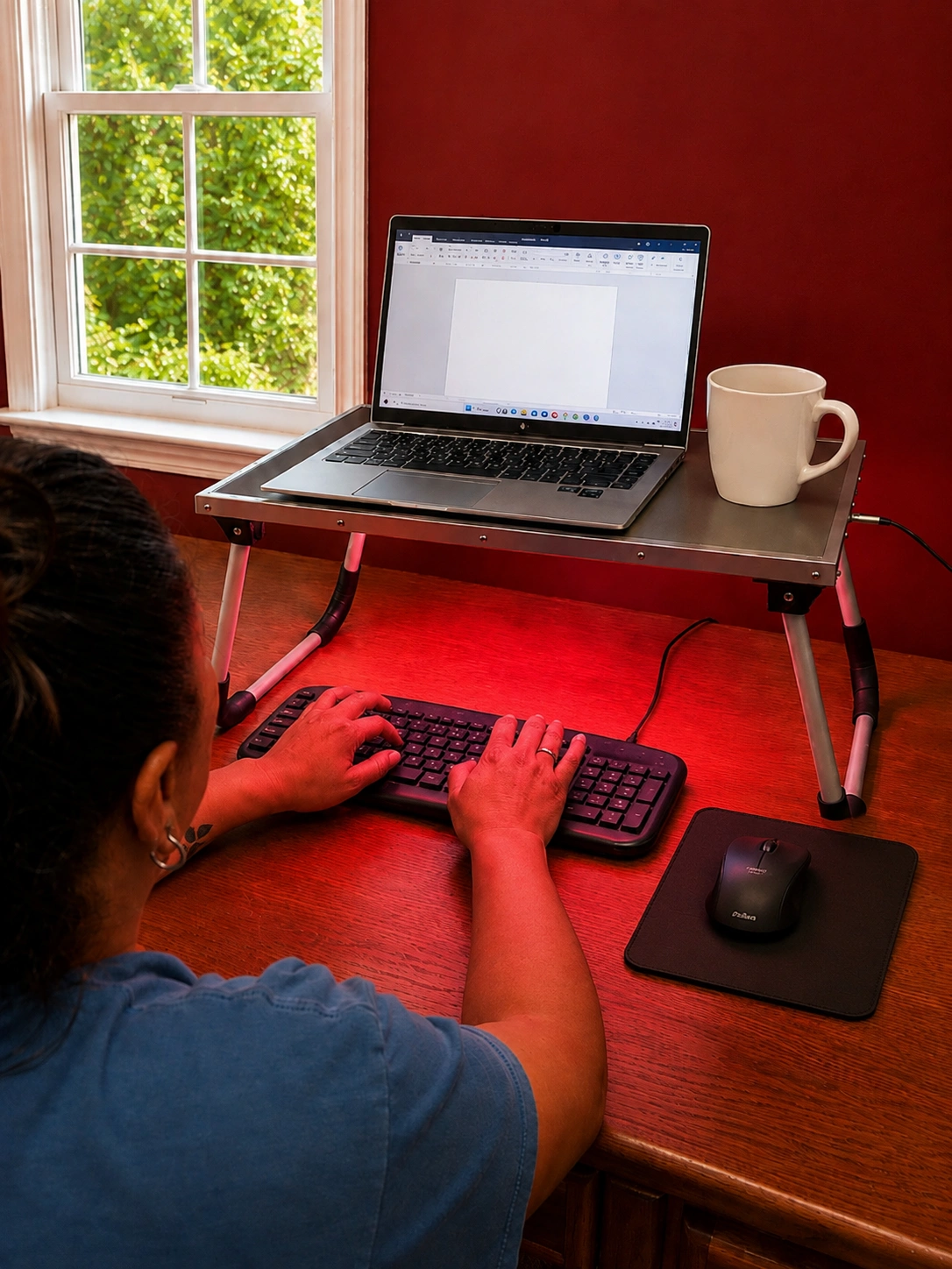 computer typing in red light